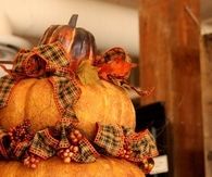 Stacked Pumpkins Decorated with Ribbons, Leaves & Berries