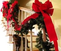 Christmas red ribbons for the banister
