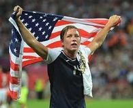US Womans Team captain raises flag