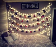 christmas Picture Or Card Pinned To Christmas Lights