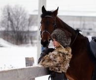 Woman and horse pose