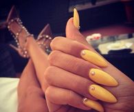 Yellow studded stiletto nails