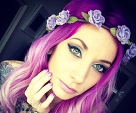 Girl with purple hair and tats