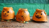 Egg carton pumpkin houses