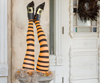 Upside down witch halloween urn