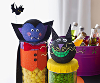 Friendly Dracula and cat candy dispensers