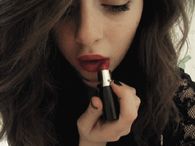Putting on lipstick