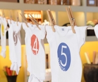 Numbered baby bodysuits