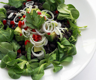 Black beans, mixed greens and chili peppers