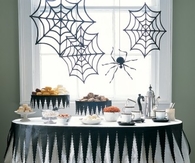 Tattered tablecloth and spider webs