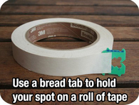 Use a bread tab to hold tape spot