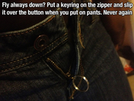 Put a keyring on the zipper and slip over button