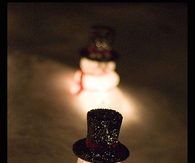 Illuminated snowmen in the snow