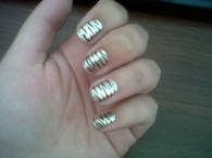Golden animal print nails