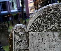 Skeleton engraved on a tombstone