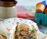 Vanilla icing pancakes with sprinkles