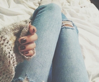 Torn jeans and warm sweater