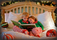Cute Kid elves reading in bed