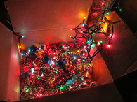 Box of christmas lights and ornaments