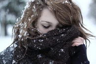 Buried in her scarf