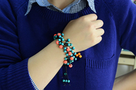Multi-strand String and Bead Bracelet