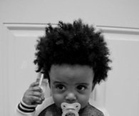 Adorable curly haired baby