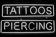 Tattoos piercing sign