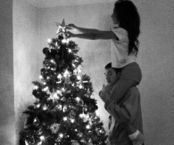 Couple decorating tree