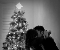 Kissing by the christmas tree