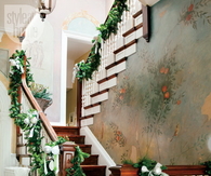 Evergreen wrapped around banister