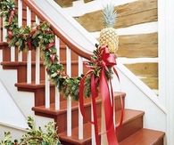 Evergreen ribbon and pineapple decoration