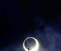 Plane over eclipse