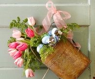 Spring watering can with flowers