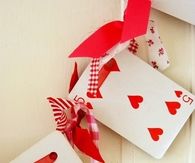Valentines day garland playing card and knotted fabric