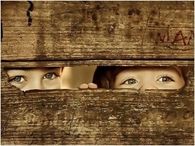 Kids Peeking Through Fence
