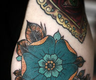 Turquoise flower tattoo