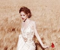Woman Strolling thru a Wheat Field