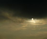 Sun in dark clouds 