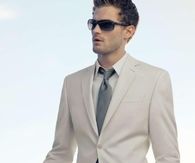 Light themed suit and sunglasses