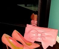 Pink clutch handbag and heels