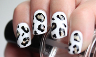 White, black and gold leopard nails