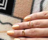 Gold sparkle nails and rings