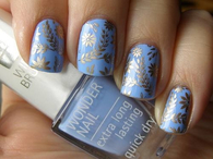 Blue nails with silver leaf art