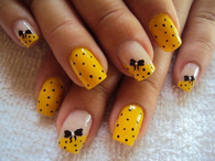 Yellow and black bow polka dot nail art