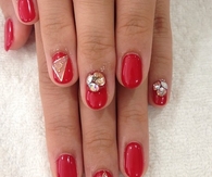 Red and gold designed nails