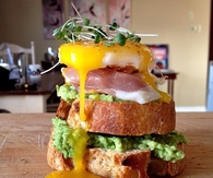 Duck egg avocado toast with prosciutto
