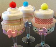 Champagne diaper cupcakes pompom