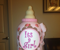 Its a girl baby bottle cake