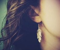 Gold feather earrings
