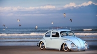 Blue Volkswagen on the Beach